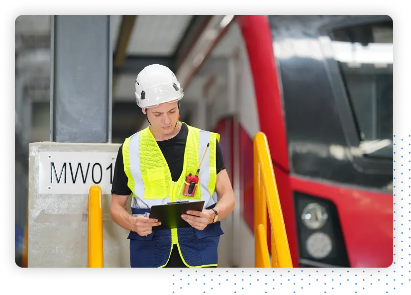 Man with clipboard next to red bus