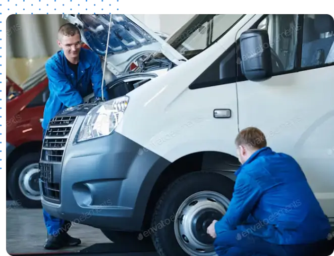 Two people performing Vehicle Maintenance
